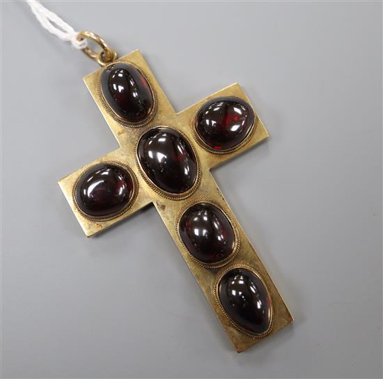 A late 19th century yellow metal and six stone cabochon garnet set cross pendant, 6cm, gross 15.4 grams.